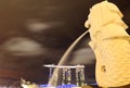 Skyline of Singapore by night, with Merlion statue and Marina Bay Sands Hotel and Singapore River