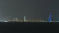 Skyline with Skyscrapers night timelapse in Kuwait City downtown illuminated at dusk. Kuwait City, Middle East Royalty Free Stock Photo