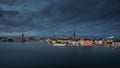 Skyline of Stockholm at night with Riddarholmskyrkan church and Stadshus on Gamla Stan old town island in Sweden