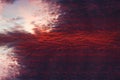 Skyline of sun rays through fiery red clouds on the sunset. Royalty Free Stock Photo