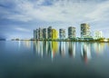 Skyline of Sunny Isles Beach by night with reflections at the surface of the ocean Royalty Free Stock Photo