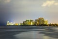 Skyline of Sunny Isles Beach by night with reflections at the surface of the ocean Royalty Free Stock Photo