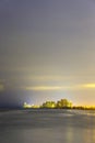 Skyline of Sunny Isles Beach by night with reflections at the surface of the ocean Royalty Free Stock Photo