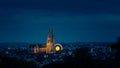 Skyline of UNESCO world heritage site town Regensburg with Octoberfest ferris wheel at night