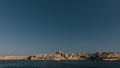 Skyline of Valletta, Malta under blue sky, with dome of Basilica of Our Lady of Mount Carmel and tower of St Paul`s Pro-Cathedral