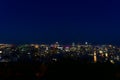 A skyline view of a city illuminated skyscrapers, buildings, and streets taken from a mountain at twilight time, Montreal, QC, Royalty Free Stock Photo