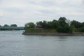 A skyline view of Dieppe park Montreal with a pergolas in the middle. Foreground is Saint Laurent River