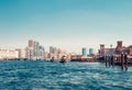 Skyline view of Dubai Creek with traditional boats and piers. Sunny summer day. Famous tourist destination in UAE