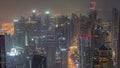 Skyline view of Dubai Marina showing canal surrounded by skyscrapers along shoreline all night timelapse. DUBAI, UAE Royalty Free Stock Photo