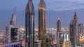 Skyline view of the high-rise buildings on Sheikh Zayed Road in Dubai aerial night to day timelapse, UAE. Royalty Free Stock Photo