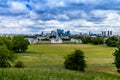 Skyline view of the skyscrapers of Canary Wharf and national maritime museum, shot from Greenwich park. London, UK Royalty Free Stock Photo