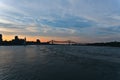 A skyline view a steel bridge across a river at the time between sunset and twilight. Jacques Cartier Bridge is across Saint Royalty Free Stock Photo