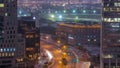 Skyline view of traffic on Al Saada street near DIFC district night to day in Dubai, UAE. Royalty Free Stock Photo