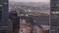 Skyline view of traffic on Al Saada street near DIFC district night to day timelapse in Dubai, UAE. Royalty Free Stock Photo