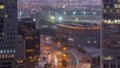 Skyline view of traffic on Al Saada street near DIFC district night to day timelapse in Dubai, UAE. Royalty Free Stock Photo