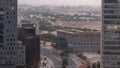 Skyline view of traffic on Al Saada street near DIFC district night to day timelapse in Dubai, UAE. Royalty Free Stock Photo