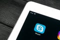 Skype application icon on Apple iPad Pro smartphone screen close-up. Skype messenger app icon. Social media icon. Social network.