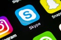 Skype application icon on Apple iPhone X smartphone screen close-up. Skype messenger app icon. Social media icon. Social network.