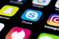 Skype application icon on Apple iPhone X smartphone screen close-up. Skype messenger app icon. Social media icon. Social network.