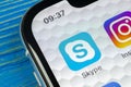 Skype application icon on Apple iPhone X smartphone screen close-up. Skype messenger app icon. Social media icon. Social network.