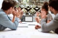 Skype call. Group of business people having video conference while sitting in meeting room. Business team looking at the Royalty Free Stock Photo