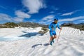 Skyrunner man uphill in a snowy stretch Royalty Free Stock Photo