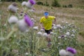 Skyrunner runs uphill along a mountain ridge. Front view, caucasian man. Sunny summer day.slovakia, tatras, Europe.