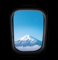 Skyscape through aeroplane window during flight in wing with blue sky.