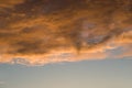 Skyscape sunset background. Colorful orange clouds on blue sky at evening Royalty Free Stock Photo