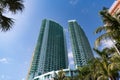 skyscraper architectural building in miami with palm trees. photo of skyscraper architectural