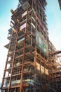 skyscraper being built, focus on the metal beams and structure