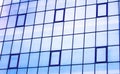 Skyscraper building windows and sky reflection in windows Royalty Free Stock Photo