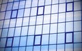 Skyscraper building windows and sky reflection in windows Royalty Free Stock Photo