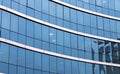 Skyscraper building windows and sky reflection in windows Royalty Free Stock Photo