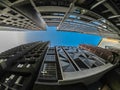 Skyscraper buildings in Sydney CBD near Wynyard railway station in fish eye angle lens with blue sky.