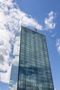 Skyscraper in business district against blue sky. Modern corporate building and architecture Royalty Free Stock Photo