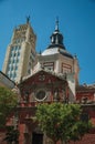 Skyscraper and church facade with dome in Madrid