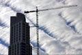 skyscraper clouds and crane Royalty Free Stock Photo