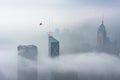 Skyscraper in downtown district of Hong Kong city in fog in monochrome Royalty Free Stock Photo