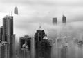 Skyscraper in downtown of Hong Kong city in fog in monochrome Royalty Free Stock Photo