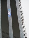 Skyscraper external elevator with persons silhouette inside