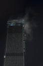 Skyscraper in the fog at night, Moscow Royalty Free Stock Photo