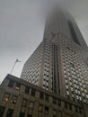 Skyscraper in a foggy day