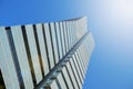 Skyscraper form below. Blue sky, sun flare and empty copy space Royalty Free Stock Photo
