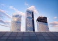 Skyscraper glass facades on a bright sunny day with sunbeams in the blue sky. Economy, finances, business development activity con Royalty Free Stock Photo