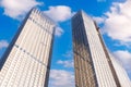 Skyscraper glass facades on a bright sunny day with sunbeams in the blue sky. Economy, finances, business development activity con Royalty Free Stock Photo