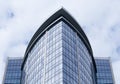 Skyscraper glass facades on a bright sunny day with sunbeams in the blue sky. Royalty Free Stock Photo