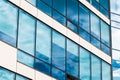 skyscraper glass wall facade square shape cells windows with reflection from the sky architecture background perspective Royalty Free Stock Photo