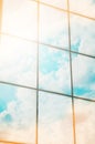 A skyscraper or modern building in a city with clouds and sunlight reflected in the Windows Royalty Free Stock Photo