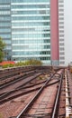 Skyscraper and the rails of the train for commuter transport in Royalty Free Stock Photo
